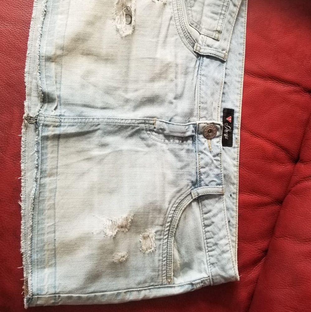 Distressed denim mini skirt